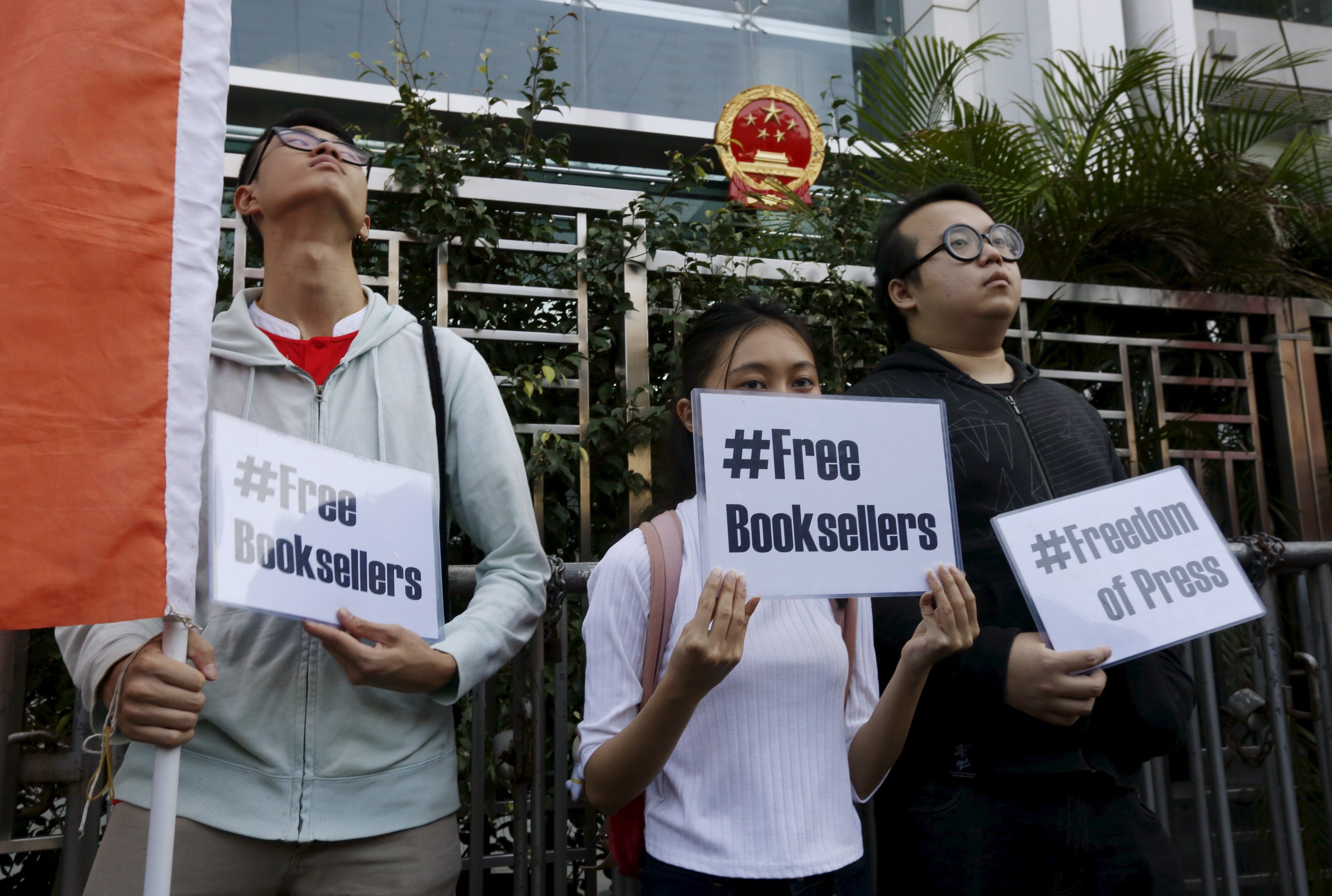 Members of student group Scholarism hold up placards during a protest about the disappearances of booksellers outside China's liaison office in Hong Kong,. Photo Credit: Reuters/達誌影像