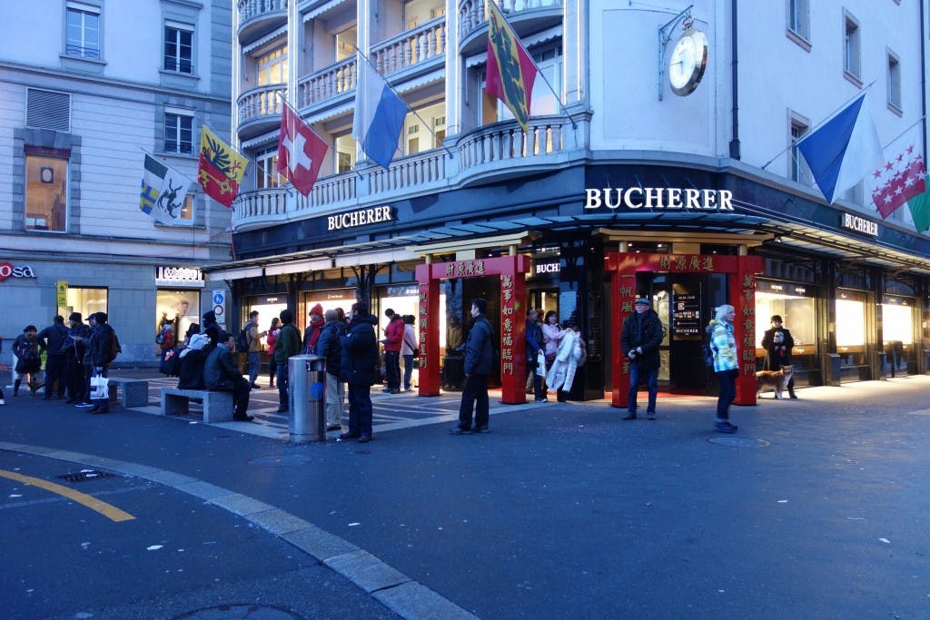 Chinese New Year couplets outside watch boutiques in Luzern to attract Chinese tourists during the New Year.