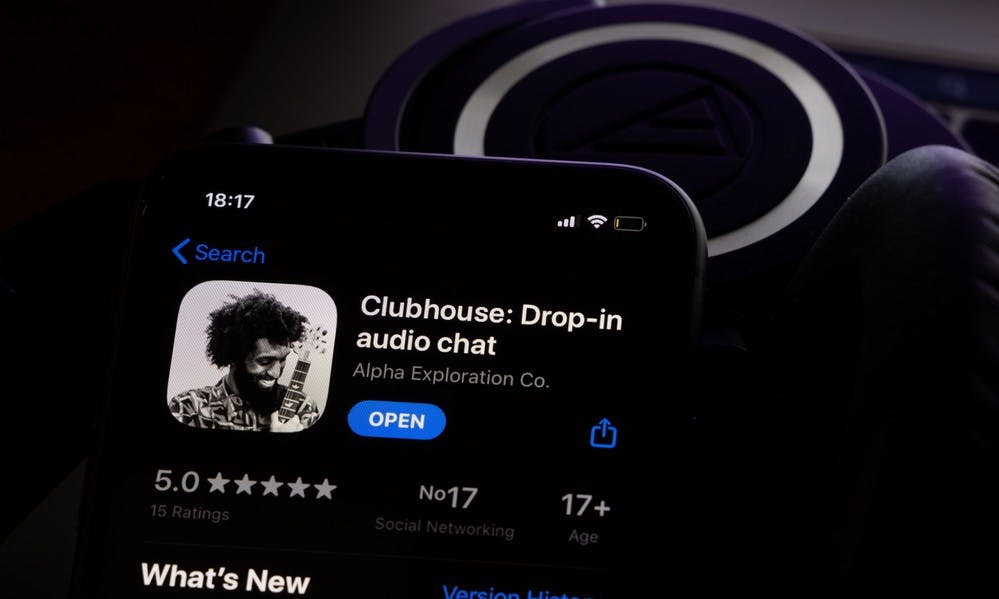 Amsterdam, Netherlands - 01.19.2021: Clubhouse application view on the smartphone, controversy 2021 that hides behind the Social app. Clubhouse drop in audio chat application view on the smartphone