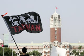 台灣魂 A demonstrator waves a flag during a protest which began Saturday afternoon in Taipei