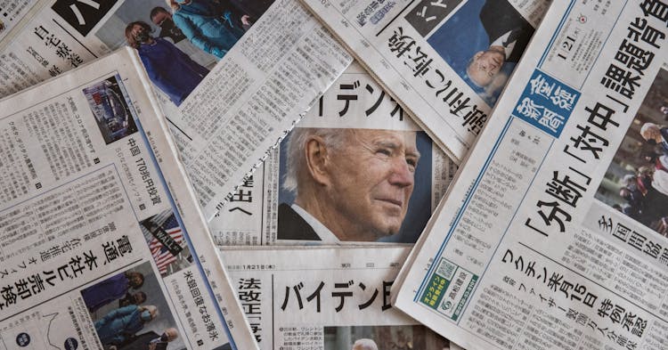 TOKYO, JAPAN - JANUARY 21: In this photo illustration, reaction to the United States Presidential Inauguration is seen on the front pages of Japanese newspapers on January 21, 2021 in Tokyo, Japan. Joe Biden was sworn in as 46th president of the United States in a ceremony that was unattended by previous president, Donald Trump, and which saw unprecedented levels of security around the White House amid concerns over protests by Trump supporters. (Photo illustration by Takashi Aoyama/Getty Images)