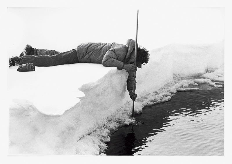 Roy ‘Fritz’ Koerner, the group’s expedition glaciologist, measuring the thickness of the floe.