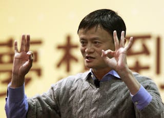 Alibaba Group Executive Chairman Ma gestures while giving a speech at National Taiwan University in Taipei