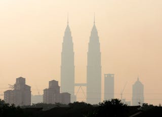 Malaysia's landmark Petronas Twin Towers is blanketed by smog in Kuala Lumpur.