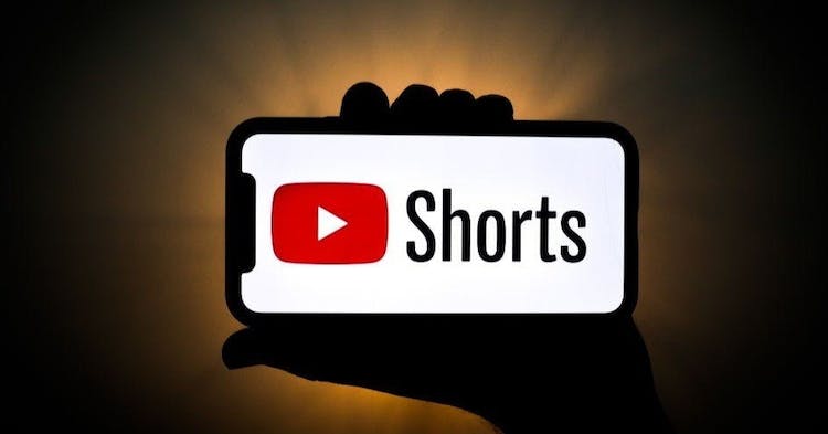 YouTube Shorts logo is seen displayed on a phone screen in this illustration photo taken on September 22, 2020 in Krakow, Poland. YouTube introduced YouTube Shorts feature that is supposed to be a competitor to TikTok. (Photo Illustration by Jakub Porzycki/NurPhoto via Getty Images)