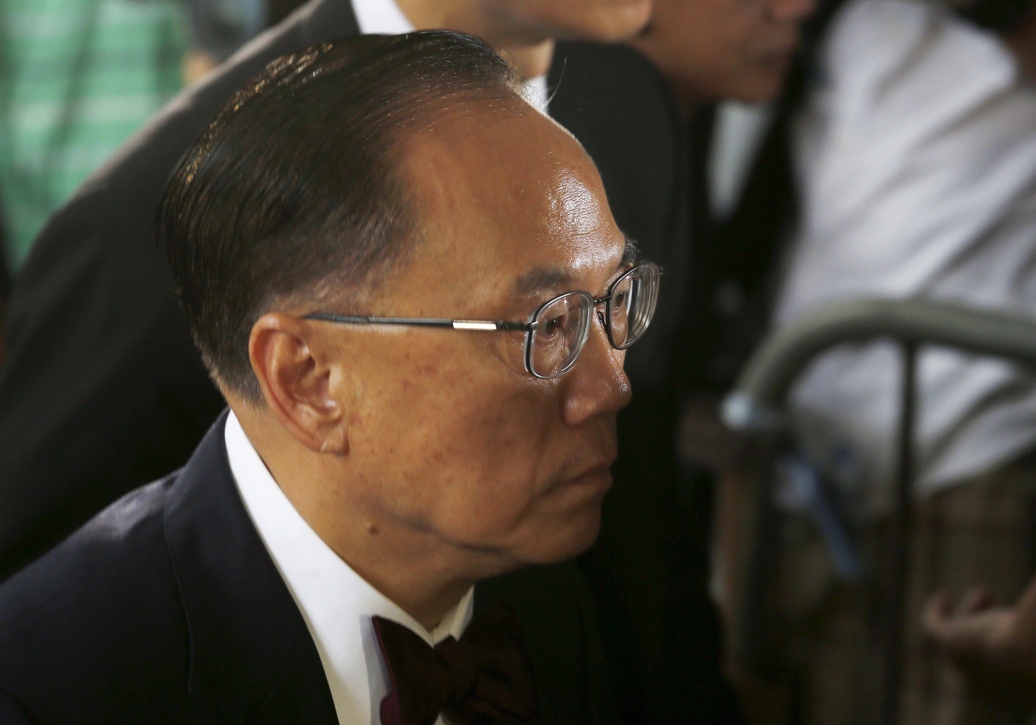 Former Hong Kong Chief Executive Donald Tsang walks into a district court in Hong Kong