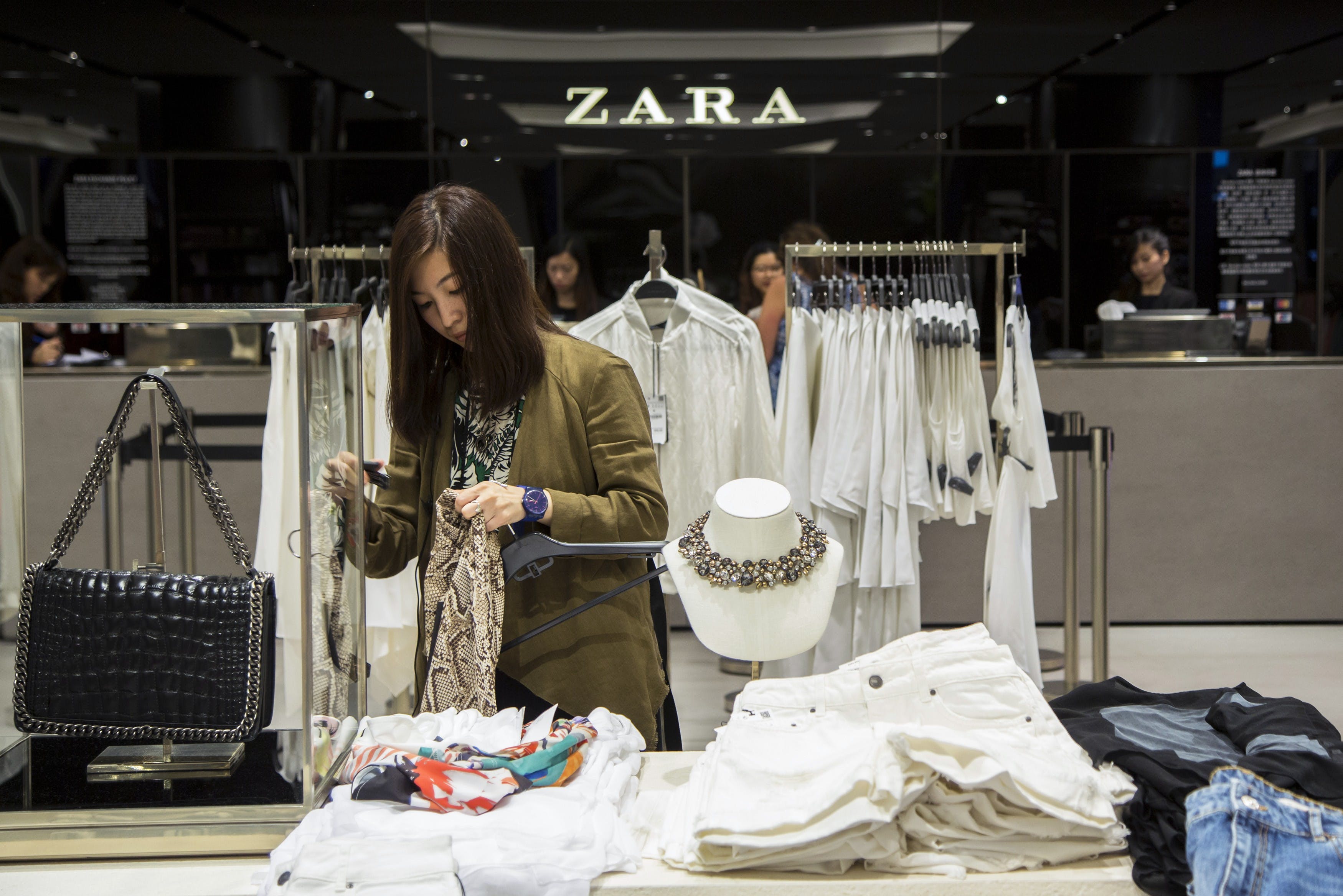 A woman browses for clothes inside Asia's largest Zara flagship store in Hong Kong