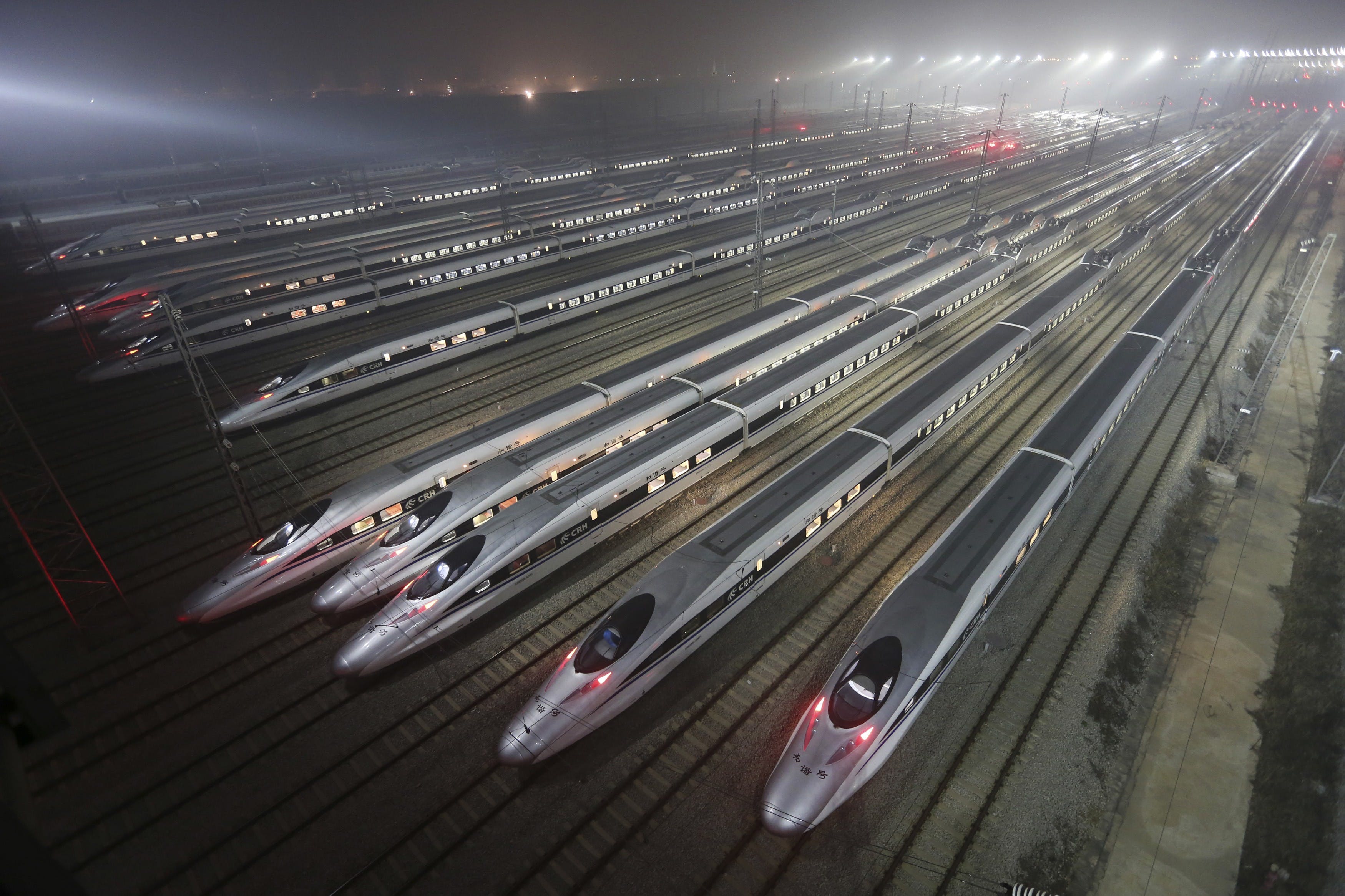CRH380 Harmony bullet trains are seen at a high-speed train maintenance base in Wuhan