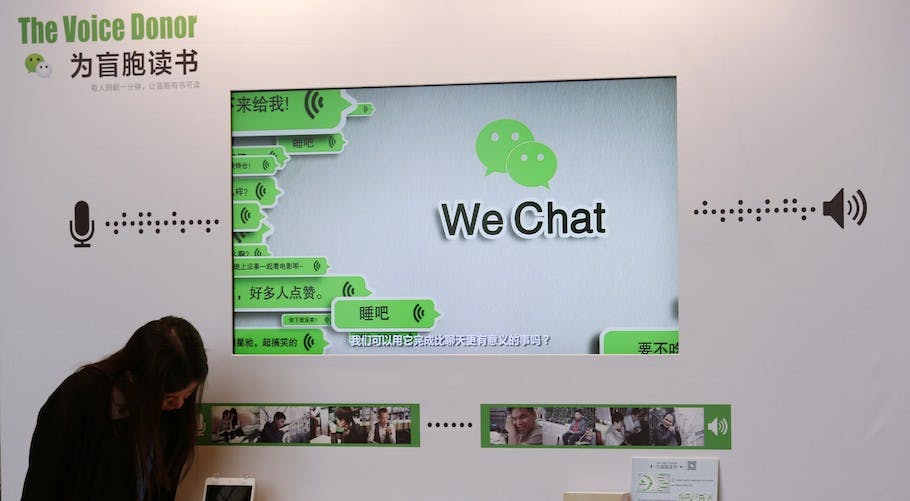 A counter promoting WeChat on reading books for the blind, is displayed at a news conference in Hong Kong