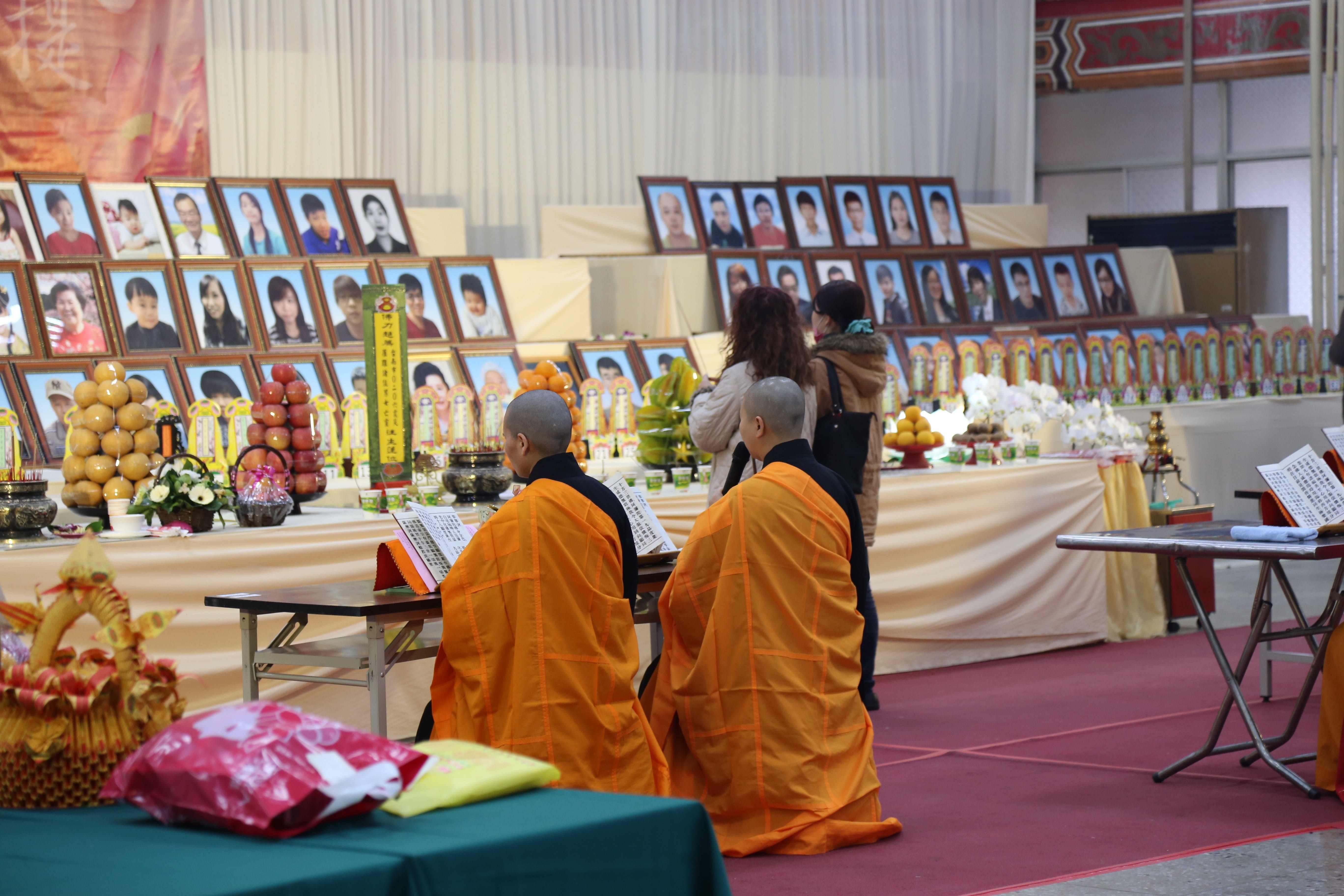 Buddhist monks chanted continuously at the funeral to calm the spirits of the deceased. Photo Credit: Tony Coolidge