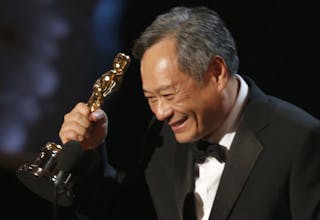 Director Ang Lee reacts after winning the Oscar for best director for "Life of Pi" at the 85th Academy Awards in Hollywood