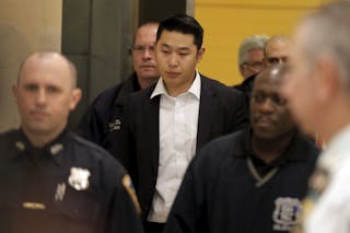 New York City Police officer (NYPD) Peter Liang is led from the court room at the Brooklyn Supreme court in the Brooklyn borough of New York. New York City Police officer (NYPD) Peter Liang is led fro