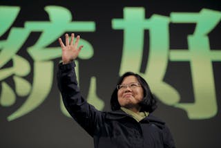 Democratic Progressive Party (DPP) Chairperson and presidential candidate Tsai Ing-wen waves to her supporters after her election victory at party headquarters in Taipei