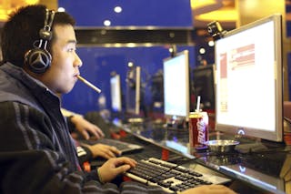 China - Zhejiang - Hangzhou - Internet in China - A Man Surfs the Internet
