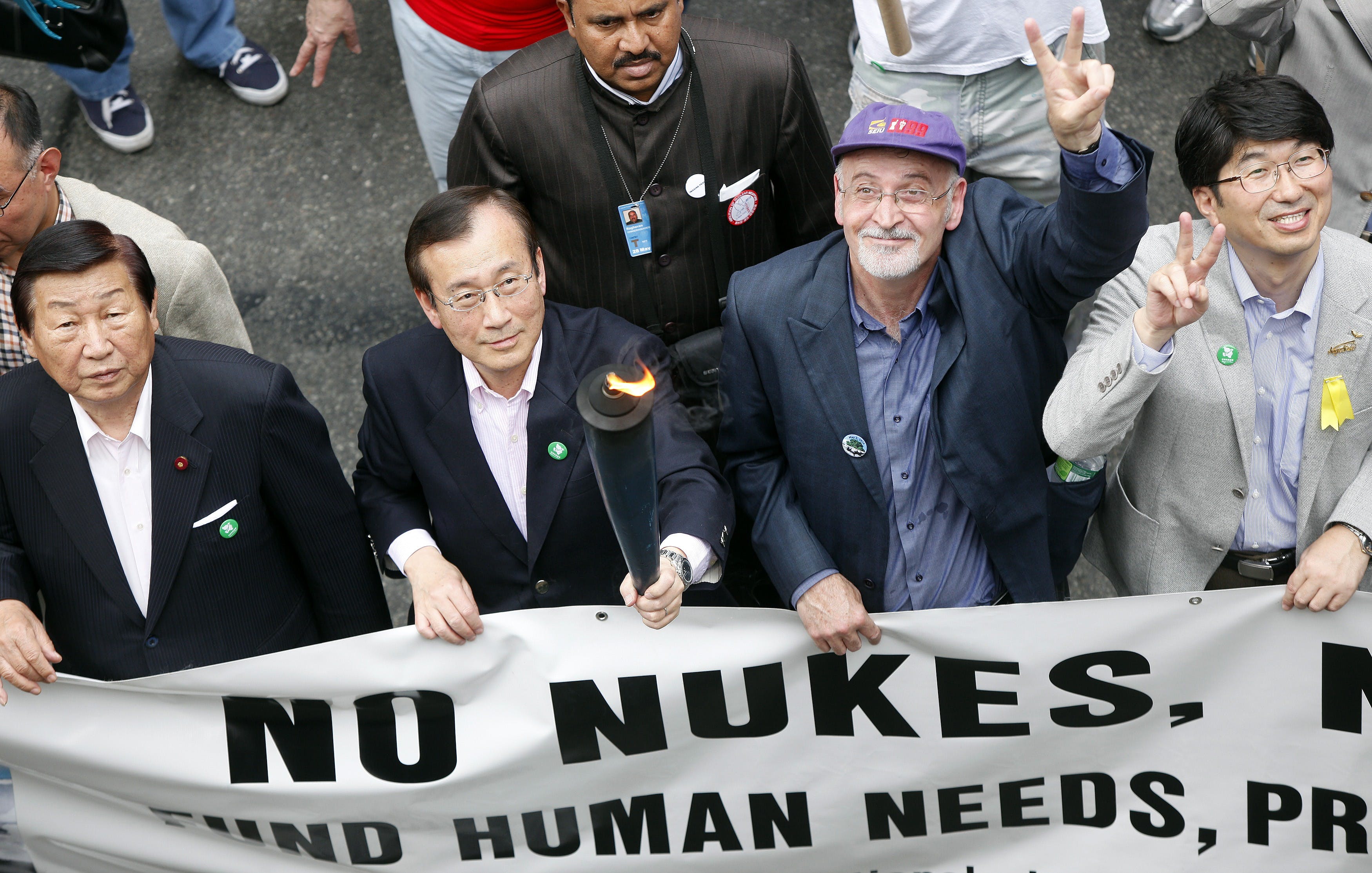 Mayor of Hiroshima Tadatoshi Akiba (2nd L) walks with other mayors including Tomihisa Taue, Mayor of Nagasaki (R), during an anti-nuclear weapons protest rally and march in New York May 2, 2010. Photo Credit: 達志影像/Reuters
