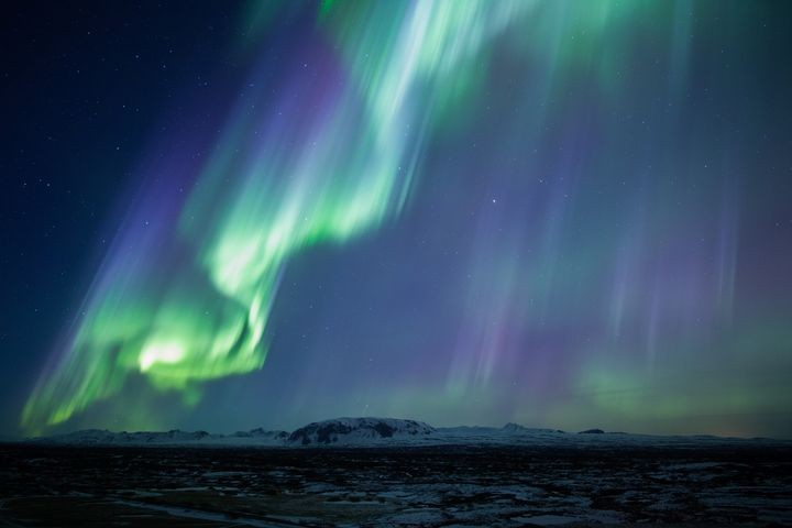 Strong,Bright,Purple,Green,Aurora,Noprthern,Lights,Over,Mountain,Lava