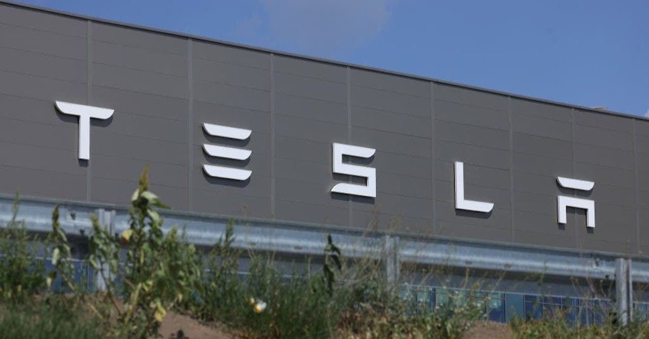 GRUENHEIDE, GERMANY - JULY 17: The Tesla logo adorns the facade of a building at the Tesla factory on July 17, 2023 near Gruenheide, Germany. Tesla will reportedly present its plans tomorrow to expand production at the factory, from thee current level of approximately 250,000 cars per year to one million. The plan calls for the construction of a new assembly hall that will be the size of 60 soccer fields, which is likely to draw opposition from local communities.  (Photo by Sean Gallup/Getty Images)