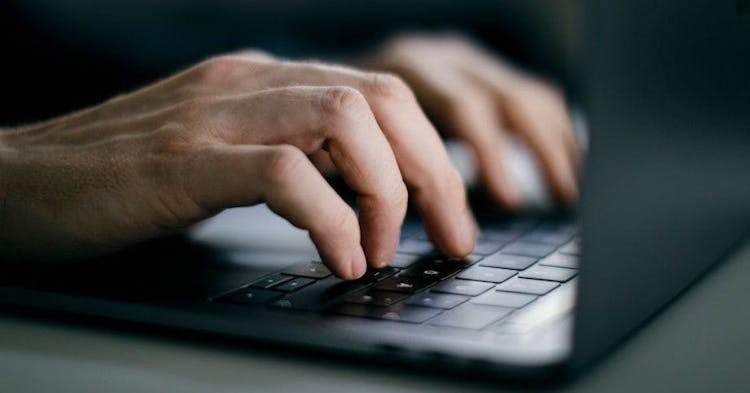 BERLIN, GERMANY - FEBRUARY 04: Hands typing on a computer keyboard (Mac), on February 04, 2020 in Berlin, Germany. (Photo by Felix Zahn/Photothek via Getty Images)