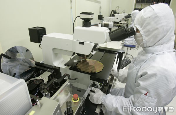 Employees work at an assembly line in Pyeongtaek