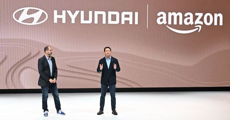TOPSHOT - Amazon Vice President of Worldwide Corporate Business Development Marty Mallick (L) and Hyundai Global President and Chief Operating Officer Jose Munoz speak at the Hyundai press conference at Automobility LA, the media preview day for the LA Auto Show, on November 16, 2023 in Los Angeles, California. (Photo by Robyn Beck / AFP) (Photo by ROBYN BECK/AFP via Getty Images)