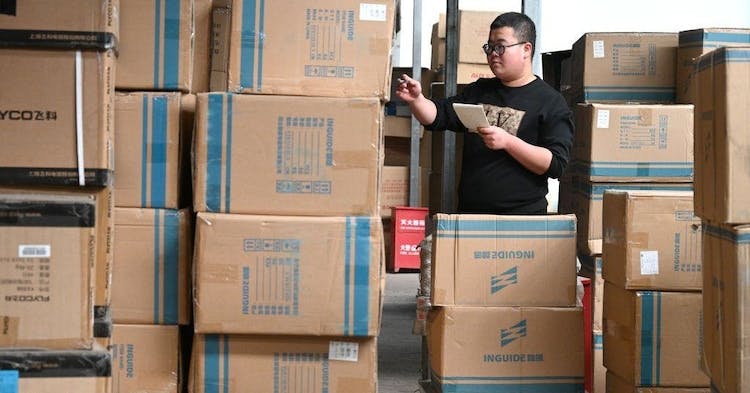 HANDAN, CHINA - NOVEMBER 7, 2023 - A staff member of an e-commerce company allocates goods at a warehouse in Handan, Hebei province, China, Nov 7, 2023. (Photo by Costfoto/NurPhoto via Getty Images)