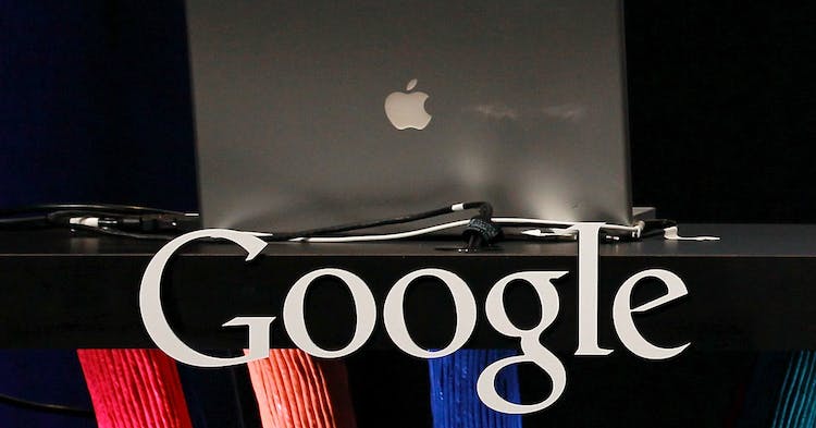SAN FRANCISCO, CA - SEPTEMBER 08:  An Apple laptop sits in a podium with the Google logo during a Google special event on September 8, 2010 in San Francisco, California.  (Photo by Justin Sullivan/Getty Images)
