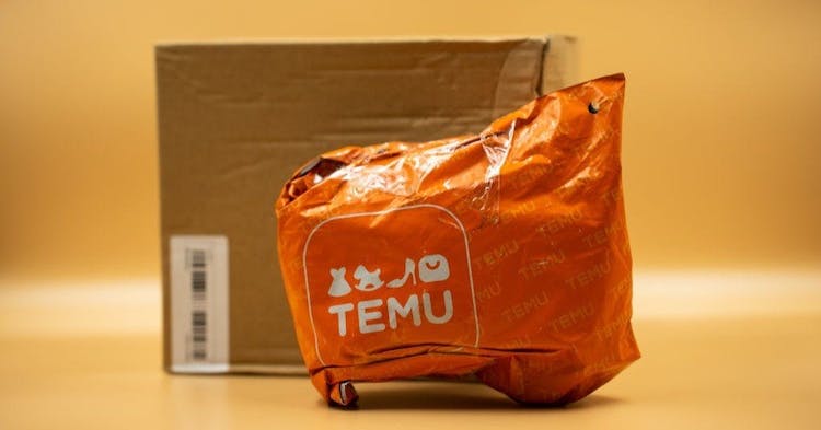 Packages from Temu. (Photo by Nikos Pekiaridis/NurPhoto via Getty Images)