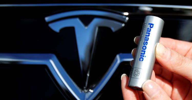 FILE PHOTO A Panasonic Corp's lithium-ion battery is pictured with Tesla Motors logo in Tokyo