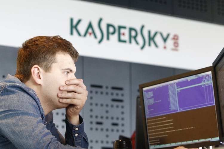 An employee works near screens in the virus lab at the headquarters of Russian cyber security company Kaspersky Labs in Moscow